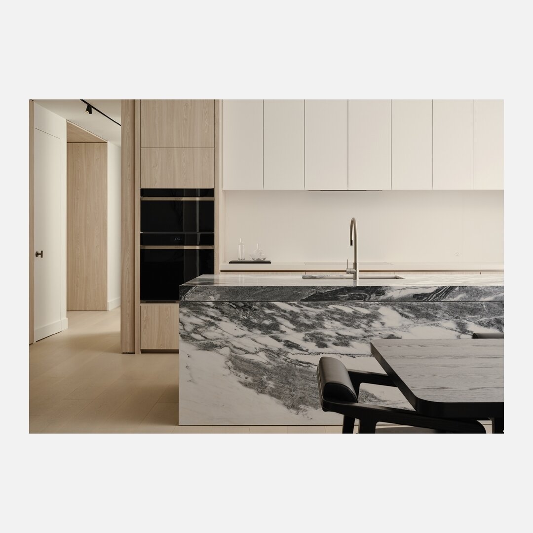 // One Roxborough West - Suite Interiors //
.
At the heart of the home, the kitchen is anchored by an expansive island sculpted in a richly textured natural stone that features full eat-in seating to complement the formal dining area.
.
Aesthetics an