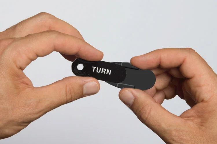 Slide the tip under the guides and secure it to the base.