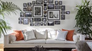 My eye goes right to the two large frames/mats and not just because they're the biggest. While the arrangement is fine, the subjects of the photos are totally lost in the small frames. Slightly larger frames and mats would pull the eye in and make these black and whites feel more special.