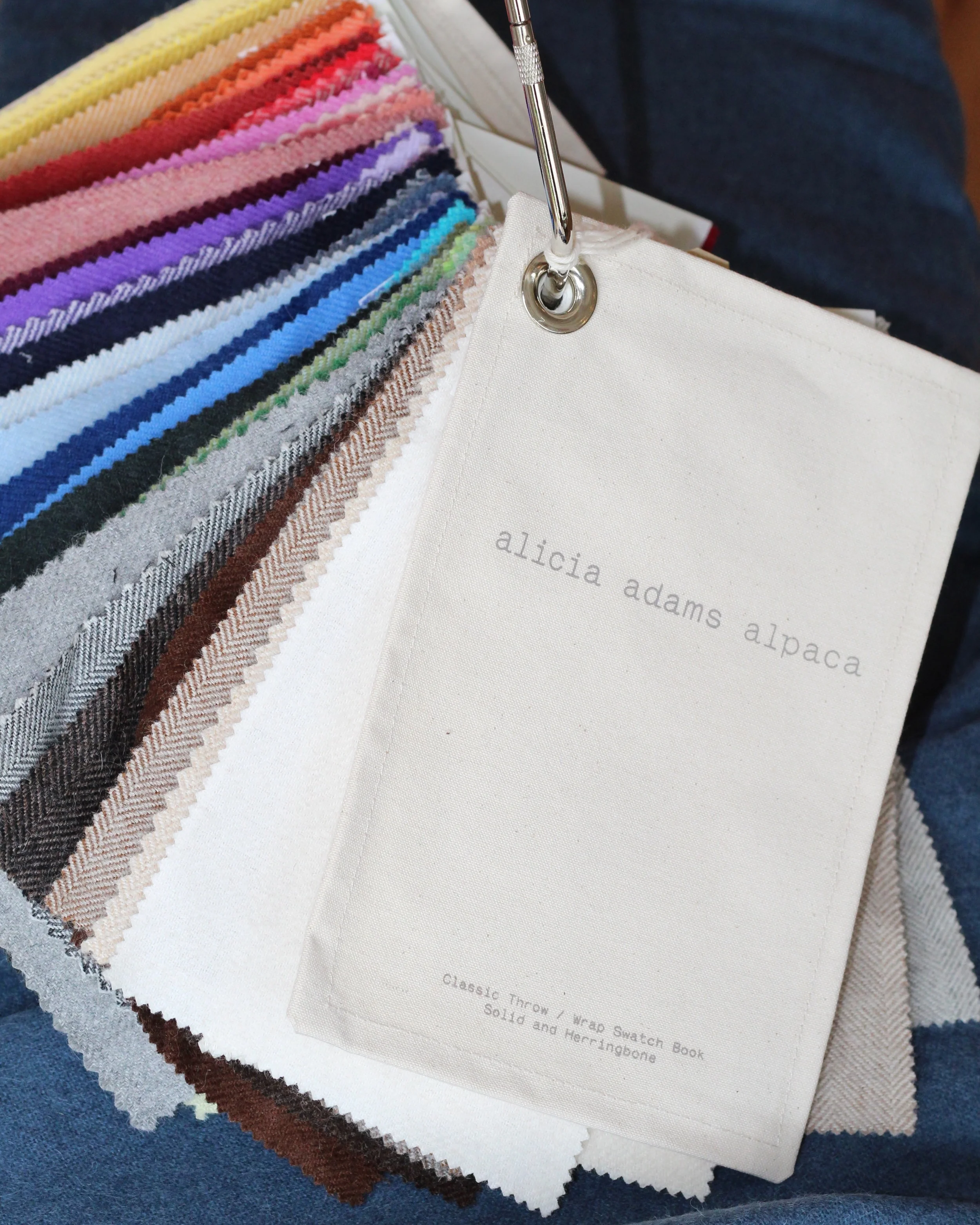 Alicia Adams Alpaca Alicia Adams Alpaca Inc. is a family business which specializes in the design and production of textiles and clothing utilizing the natural and sustainable characteristics of one of the rarest and most luxurious materials – alpaca wool. Alpaca wool, one of the world’s most luxurious fibers, is a jewel amid all the synthetic fibers and harsh materials found in our everyday lives. Softer than cashmere, and available in a wide array of colors, alpaca serves as a natural thermostat by using microscopic air pockets to trap body heat in cooler temperatures and to release heat in warmer weather.