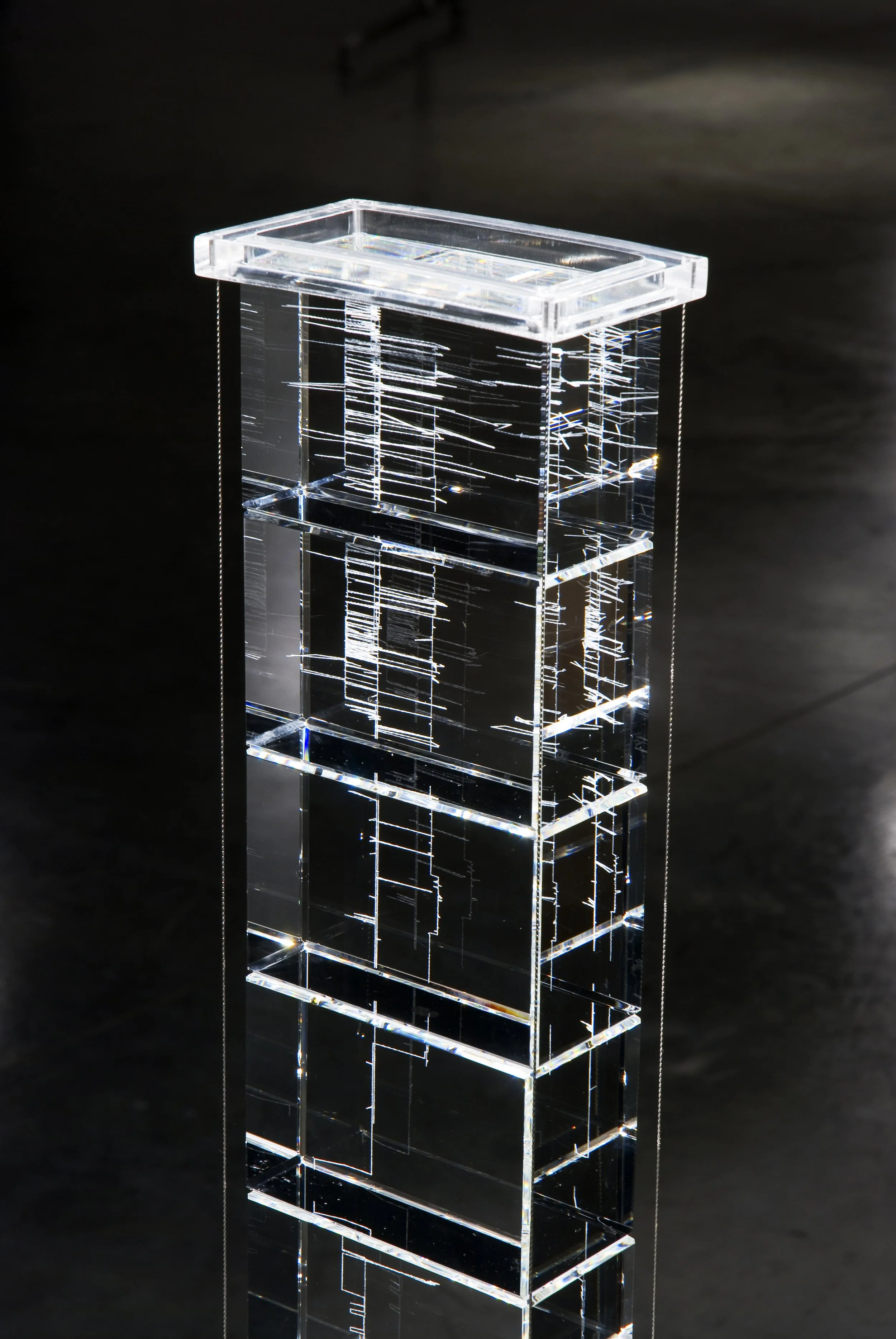  Family Tree ( 1937-2007)  2007  |  Laser engraved crystal  |  22×5×2.5in.   This piece follows the movement of a family over the course of seven decades.  
