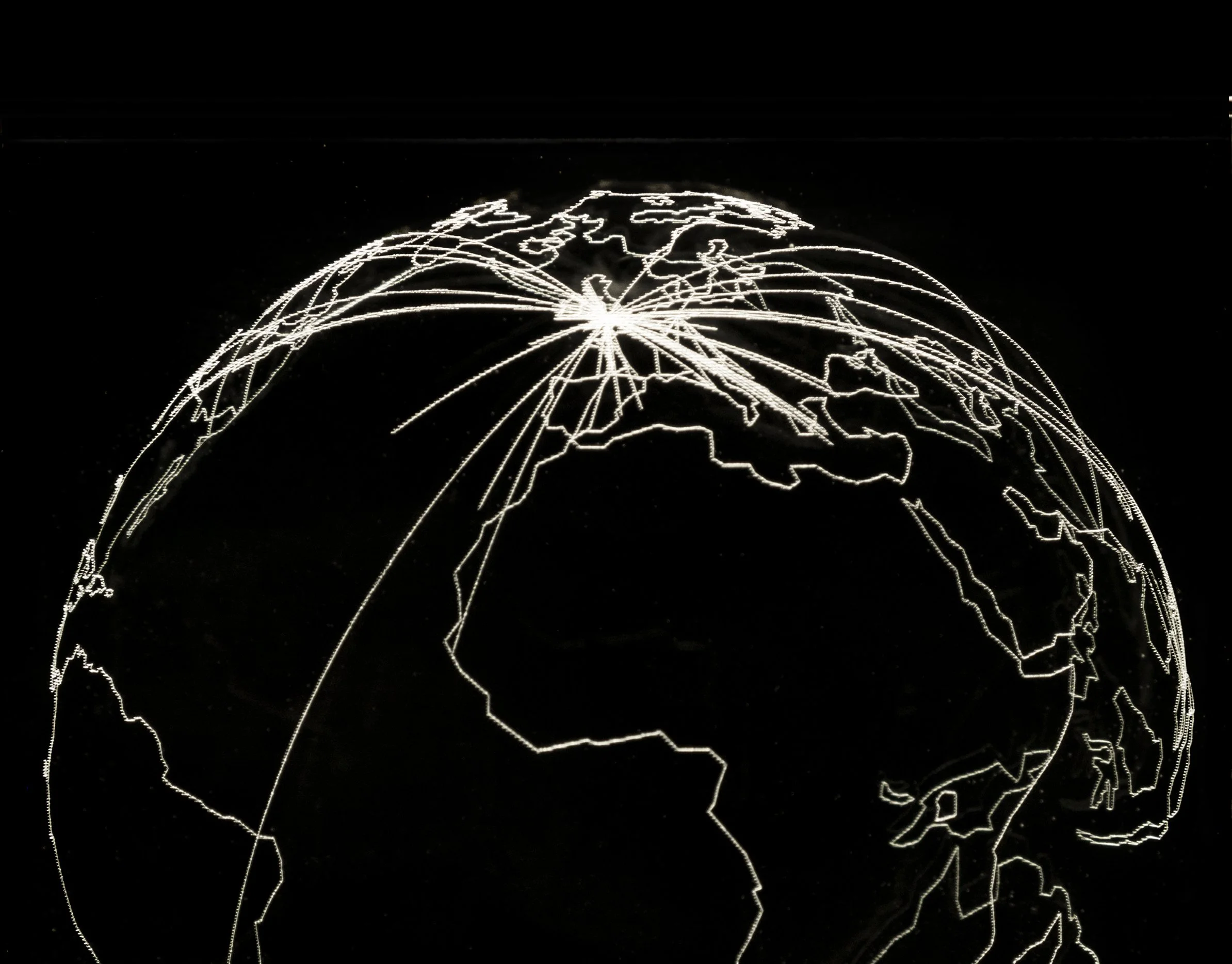  Global Movements (19  2018  |  Laser engraved crystal  | 4×4×4in.   This piece plots the travels of two people on the globe over 75 years. 
