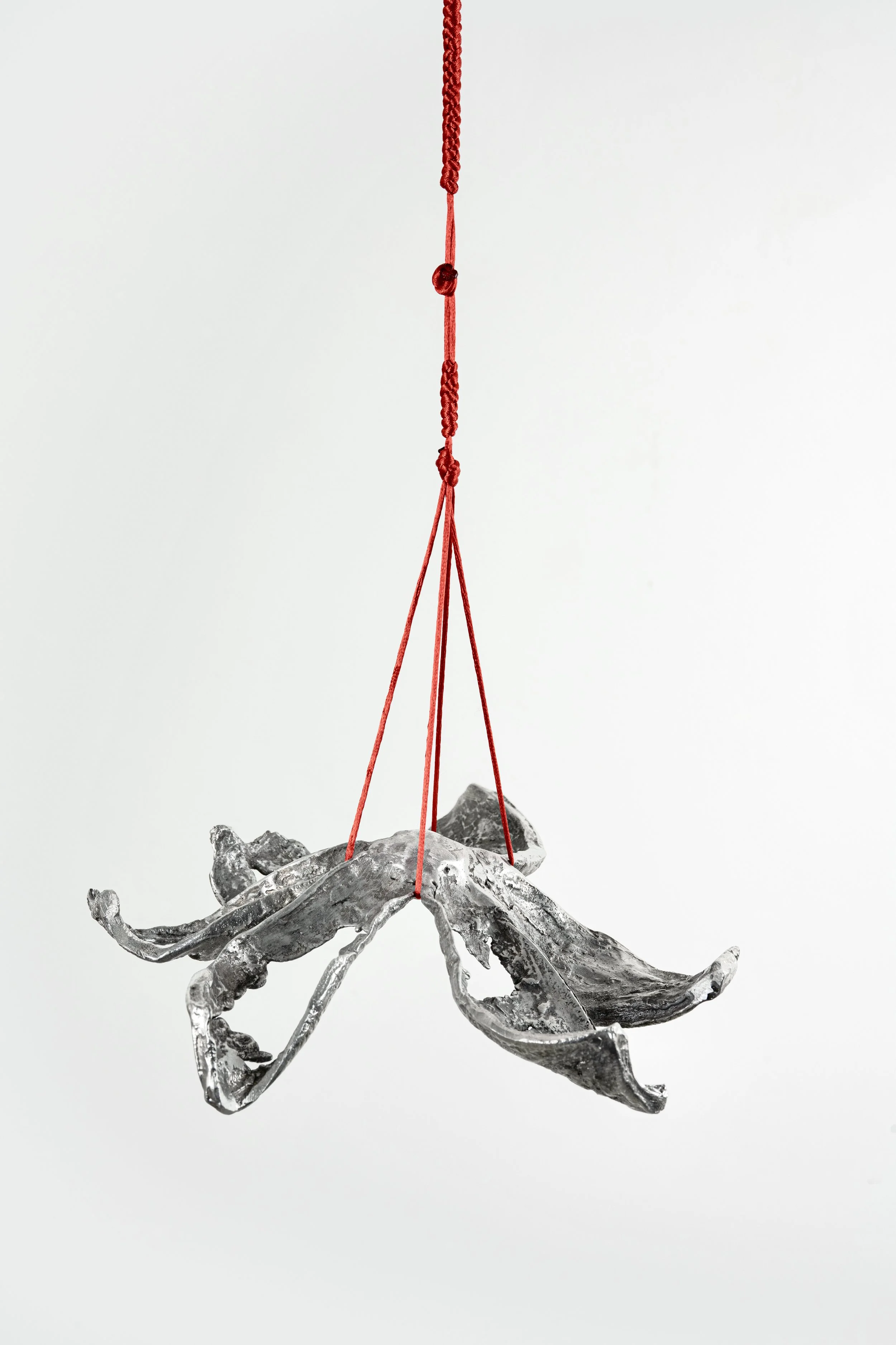 Pomelo Skin, 2025, aluminum and red jewellery thread