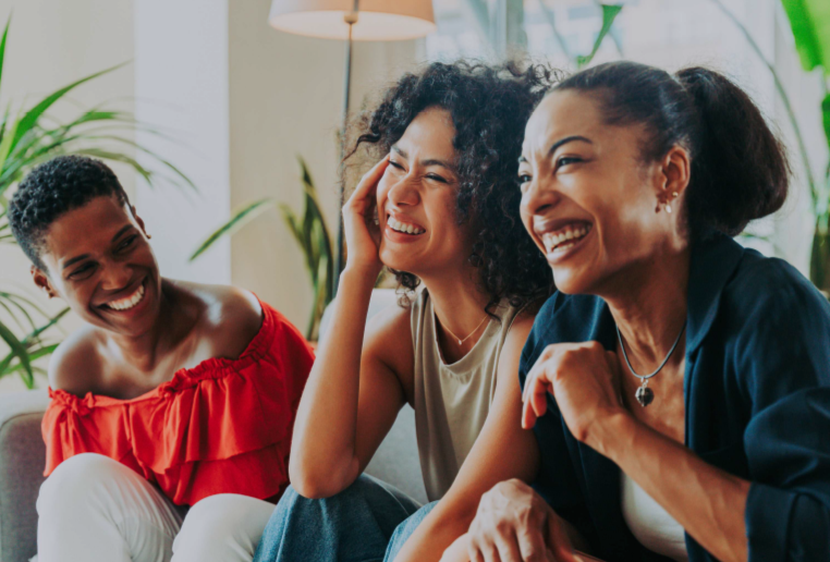 women seated smiling.png
