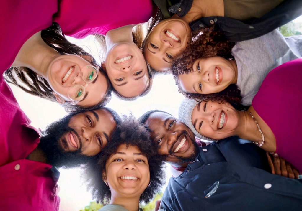 Circle of smiles, hugging in unity
