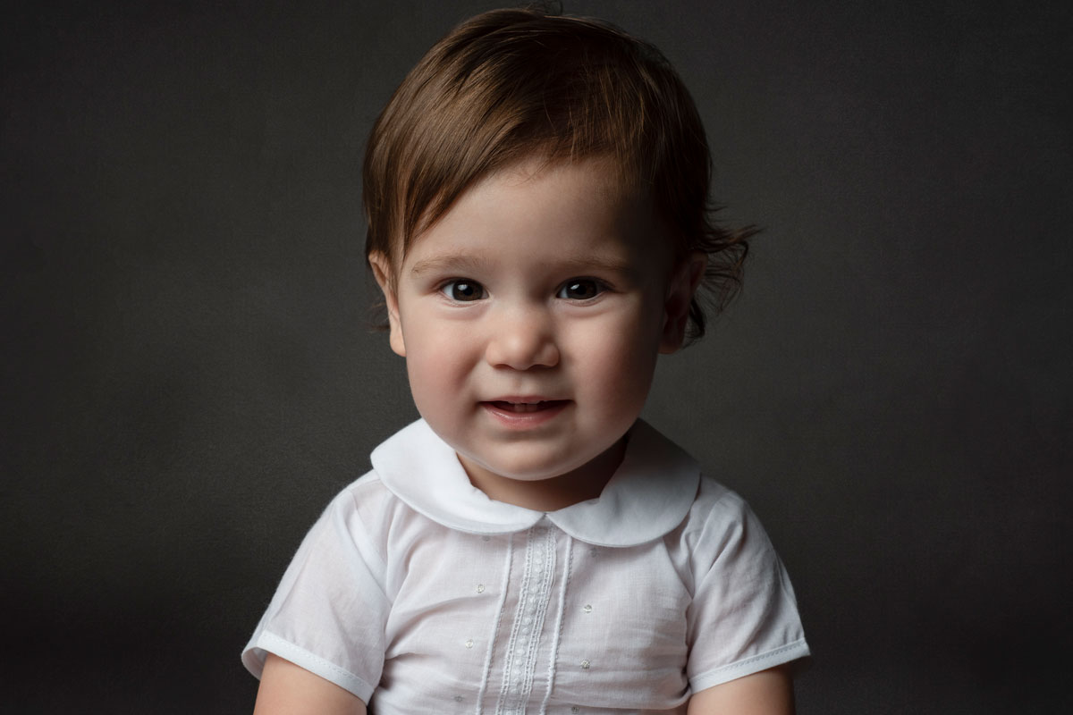 Boy in white peter pan color romper