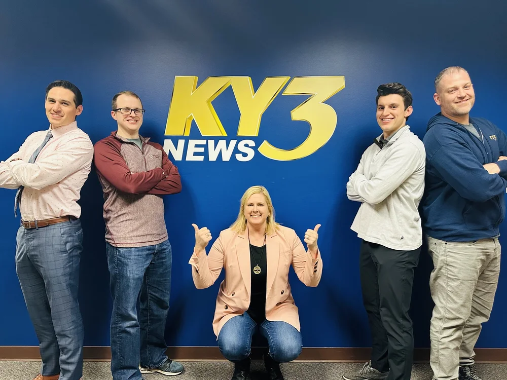 Ozone Sports Team with a random woman...