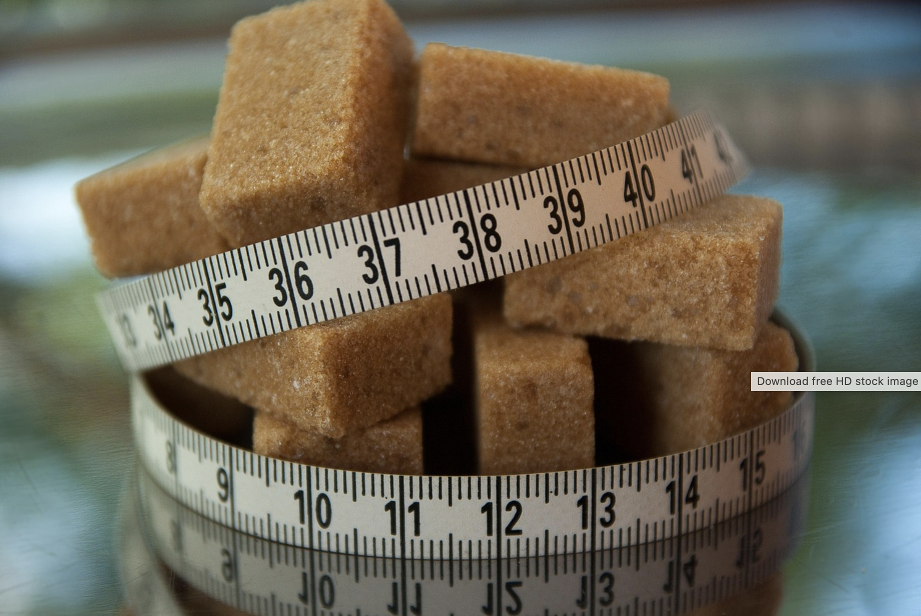 Sugar cubes wrapped in a tape measure