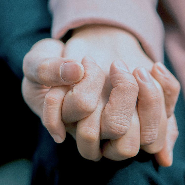 Couple holding hands during therapy