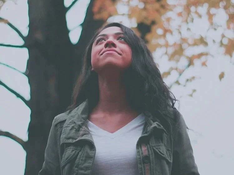 hopeful woman outside after starting therapy