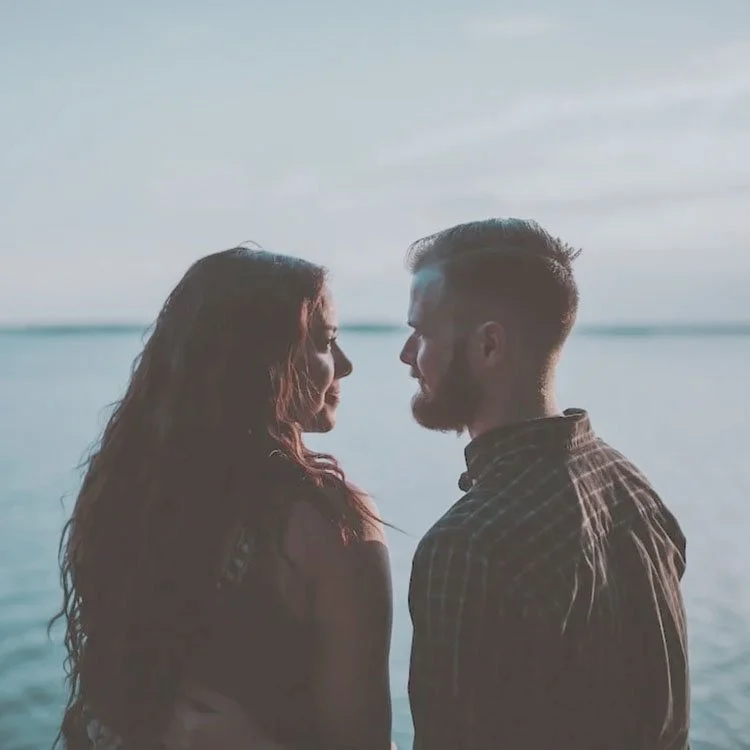 Couple outside by water