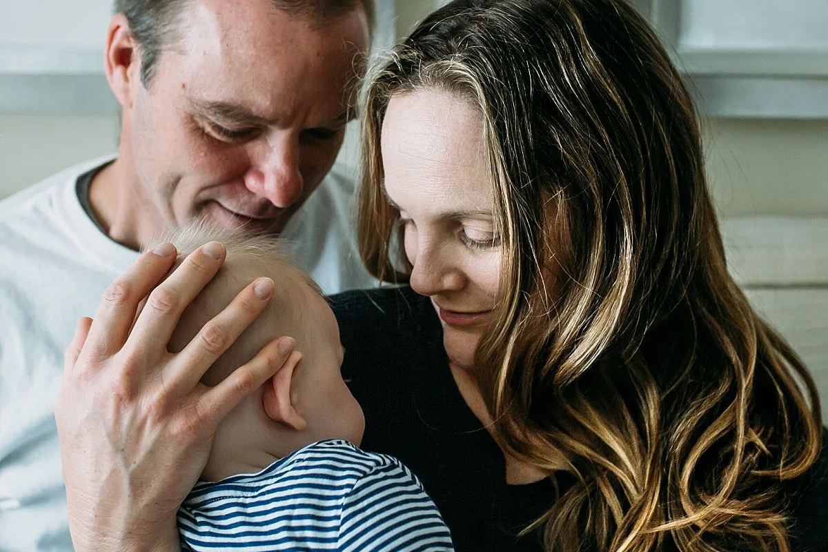 nyc newborn and family photographer intimate close up of mom, dad and baby