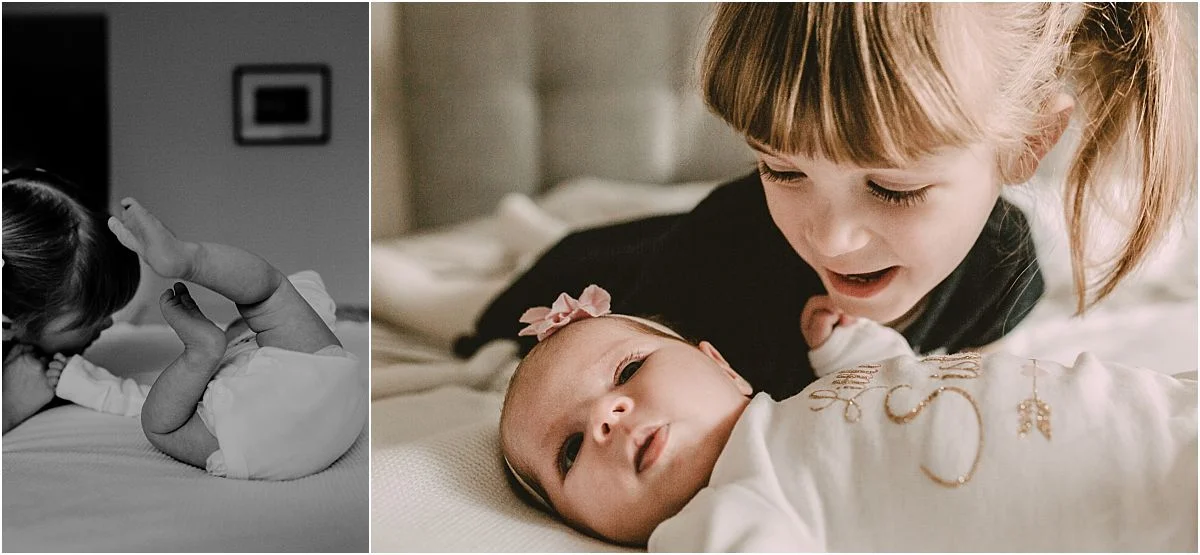 nyc family and newborn photographer newborn and big sister play on parents bed