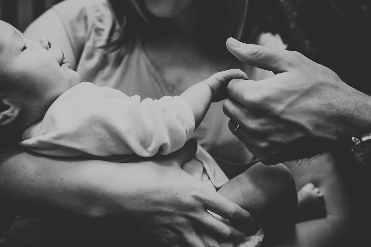 nyc family and newborn photographer close up of baby girl in stairwell in Chelsea apartment block