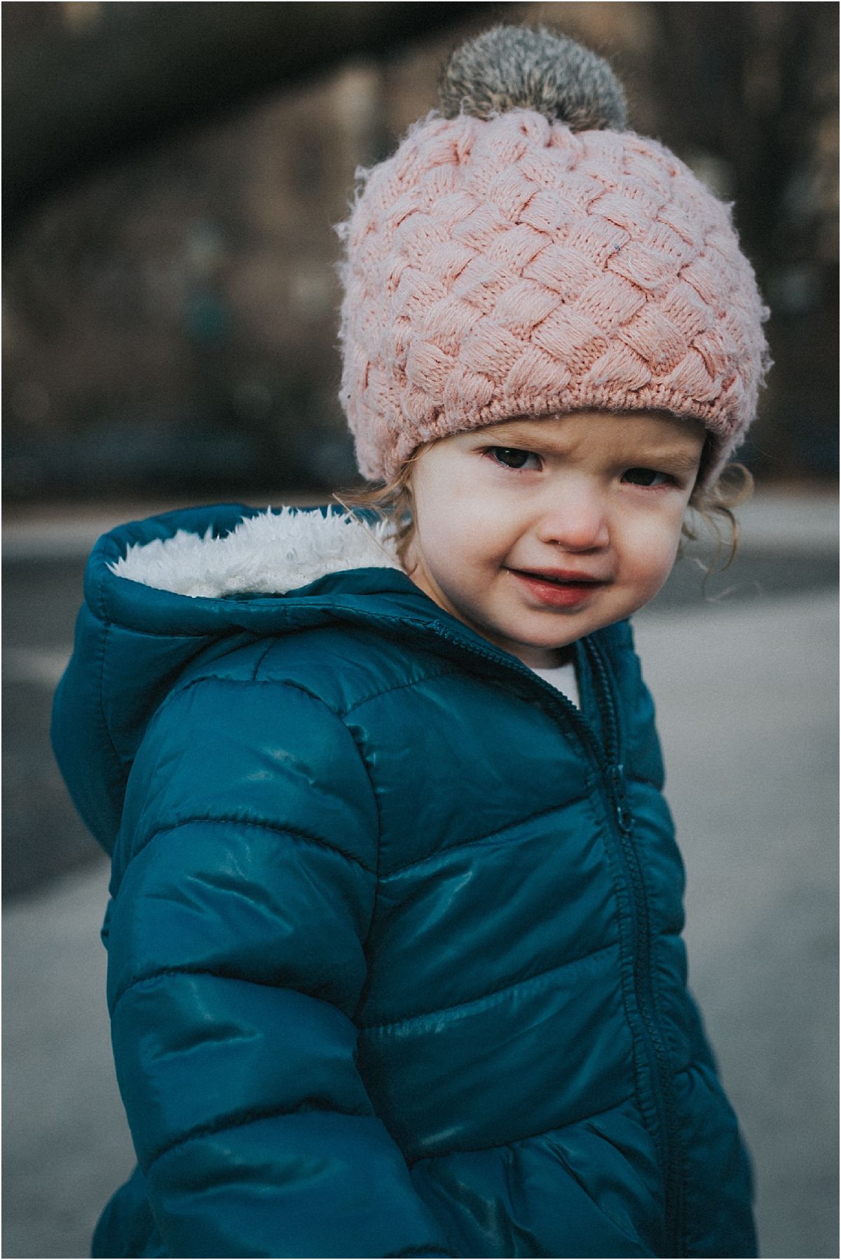 nyc family and newborn photographer close up of toddler in beanie in nyc park on the upper west side