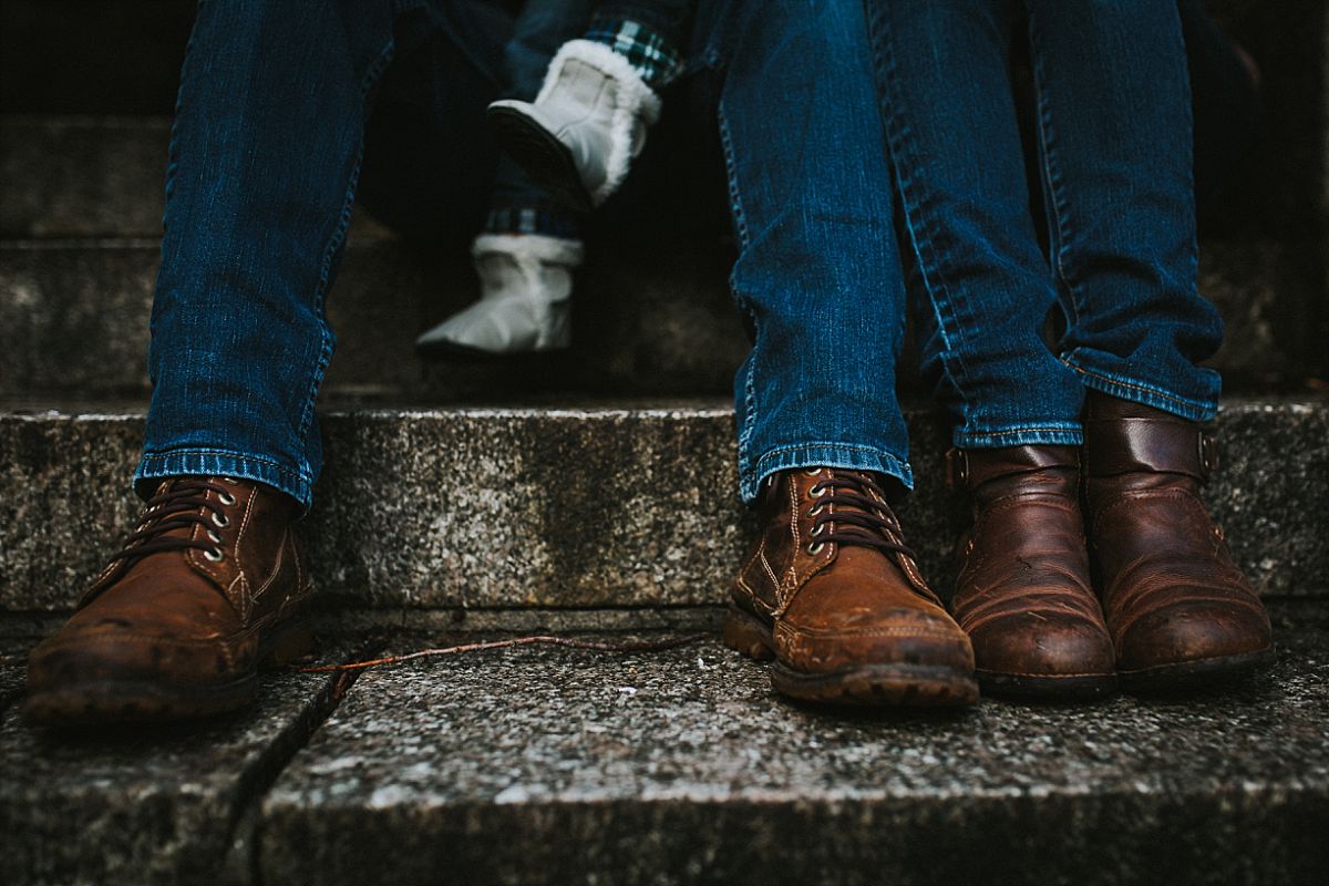 nyc family and newborn photographer mom, dad and toddler shoes on park steps on fort tryon park in nyc