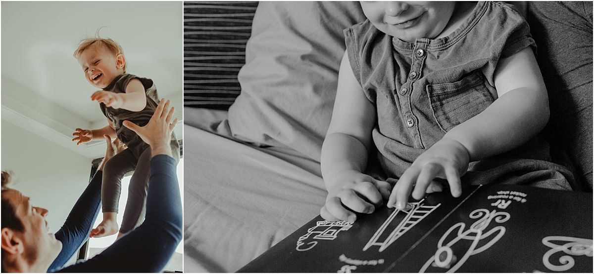 nyc family and newborn photographer father throws giggling son in the air while on near light filled window