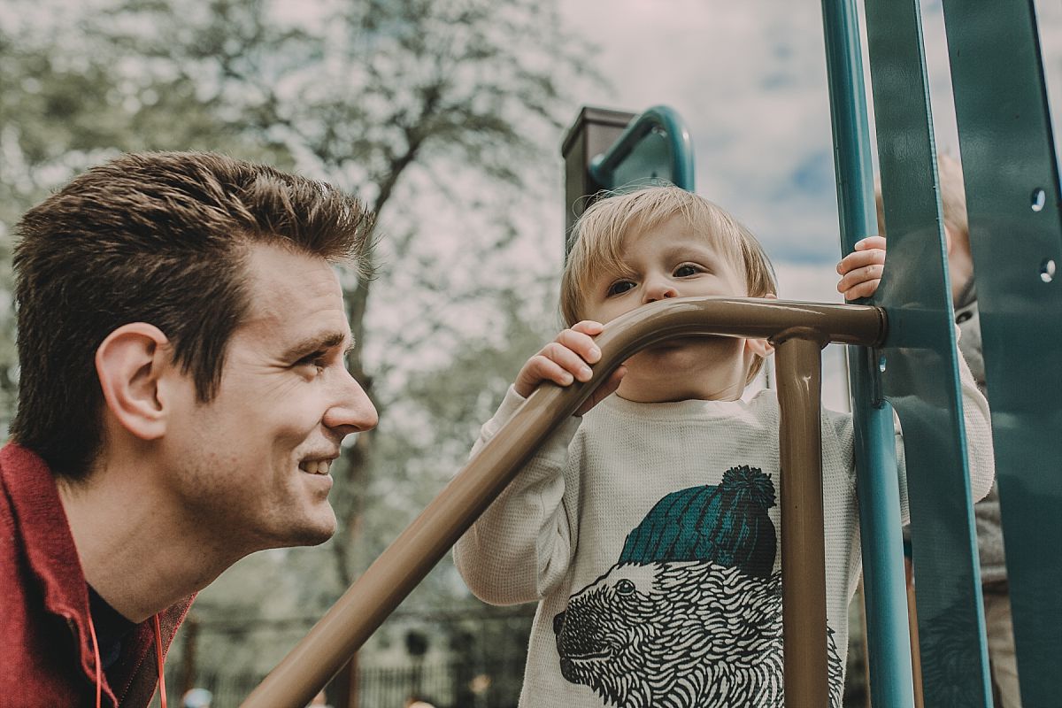 nyc family and newborn photographer mom and son enjoy park time at indian road playground in manhattan