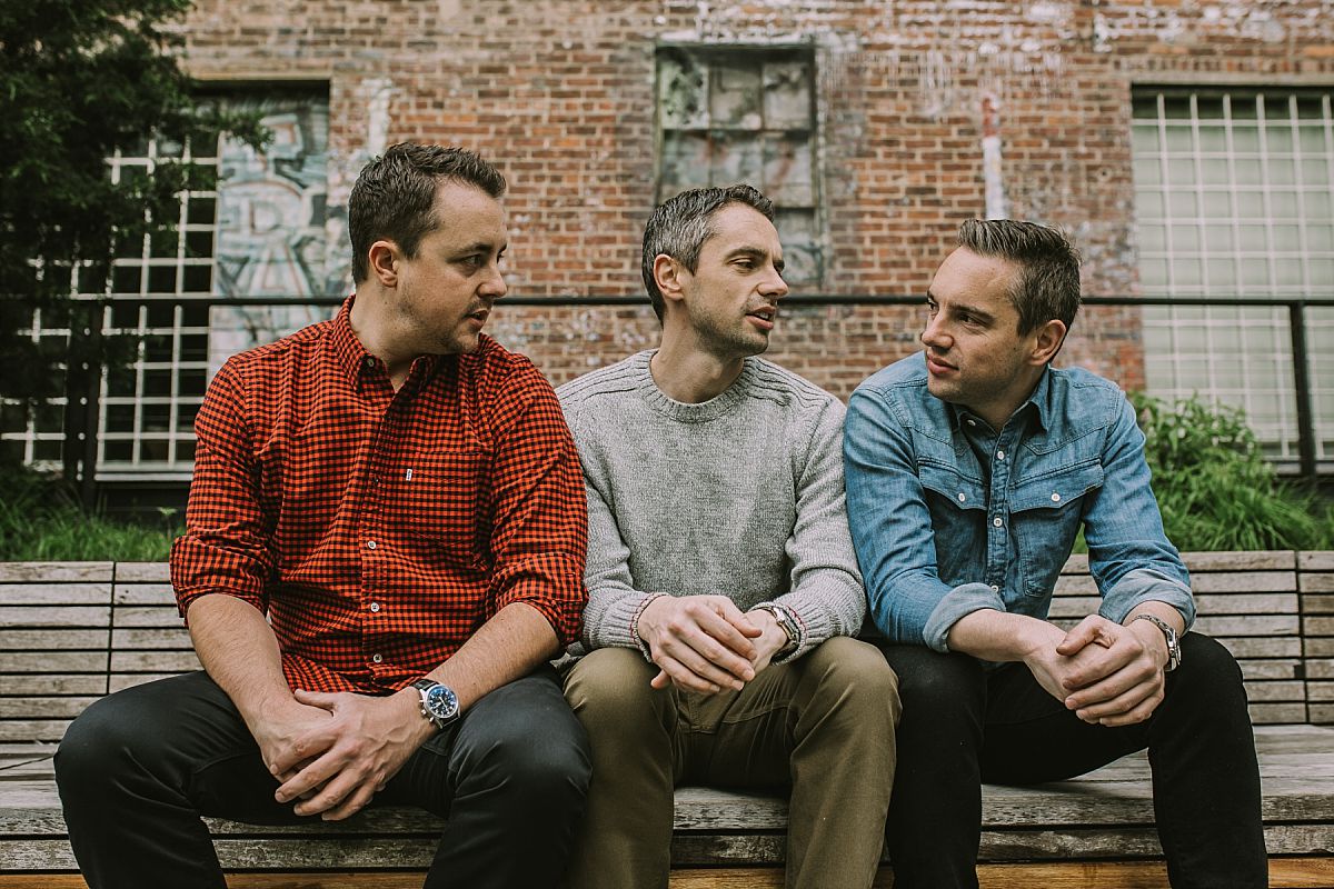 Krystil McDowall Photography captures three brothers having a chat at the highline in nyc
