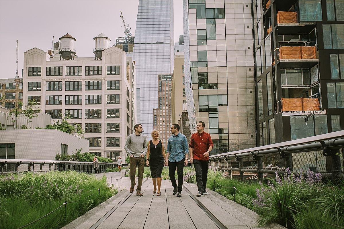 mom and three sons walking the footpaths of the highline in nyc