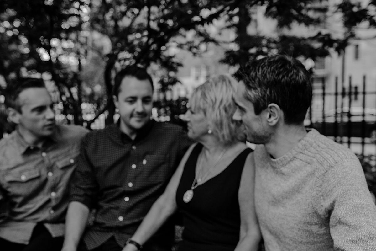 family of four at nyc park on sunny morning during family lifestyle photo session