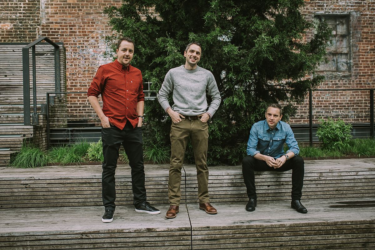 three handsome brothers enjoying time at the highline in nyc. nyc family and newborn photographer krystil mcdowall photography