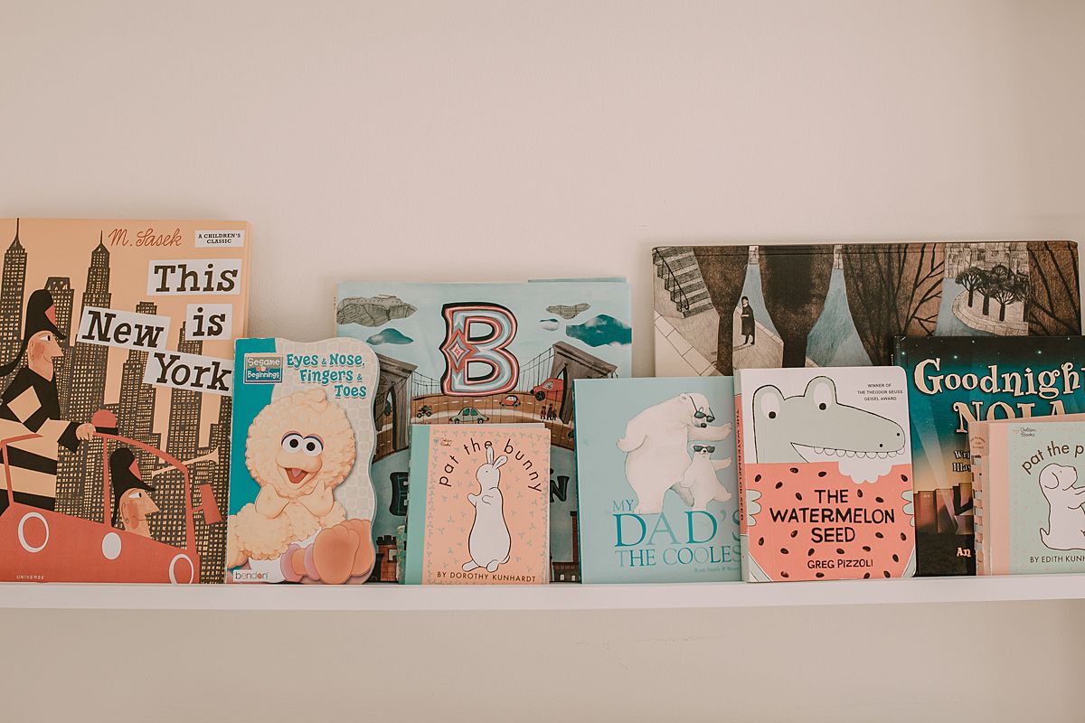 newborn details in baby room. fun and colorful kids books. image by krystil mcdowall photography