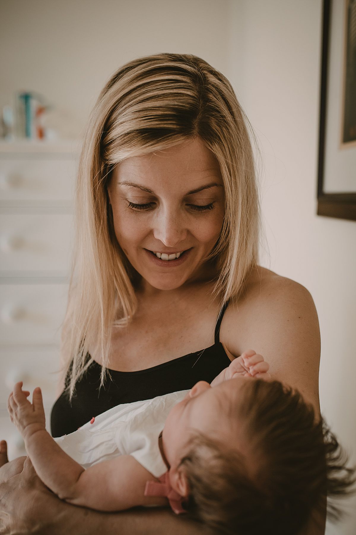 close up of mom, looking at daughter during nyc family lifestyle session