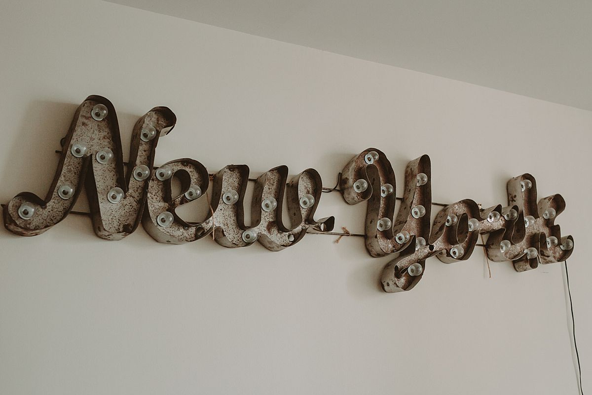 details photo of new york sign in downtown manhattan apartment. photo by nyc family and newborn photographer krystil mcdowall