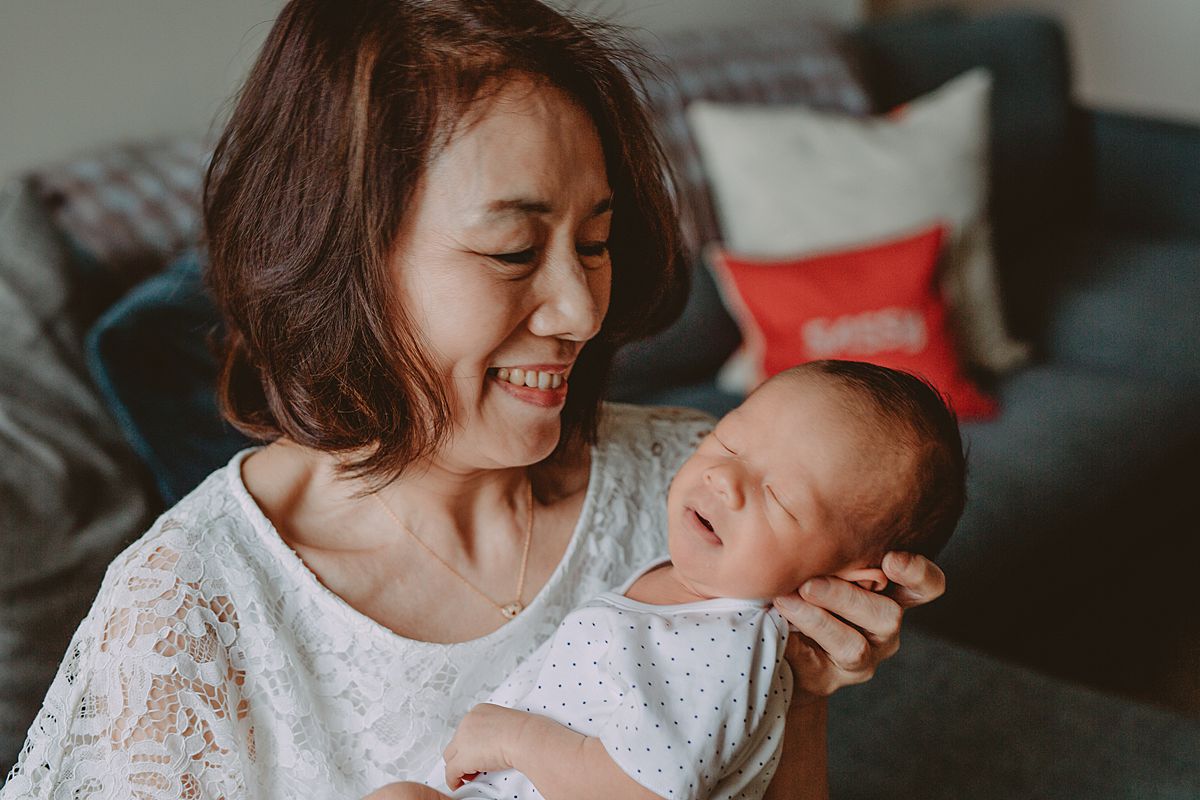 image of grandma holding grandson in nyc family documentary session. photo from krystil mcdowall
