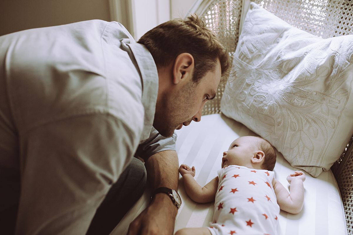 dad and daughter have a moment. image by nyc family and newborn photographer krystil mcdowall