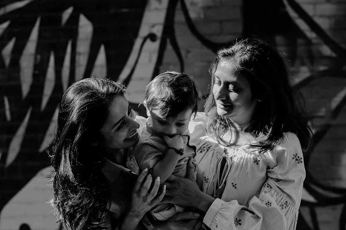 mom, sister and son playing peek-a-boo in brooklyn