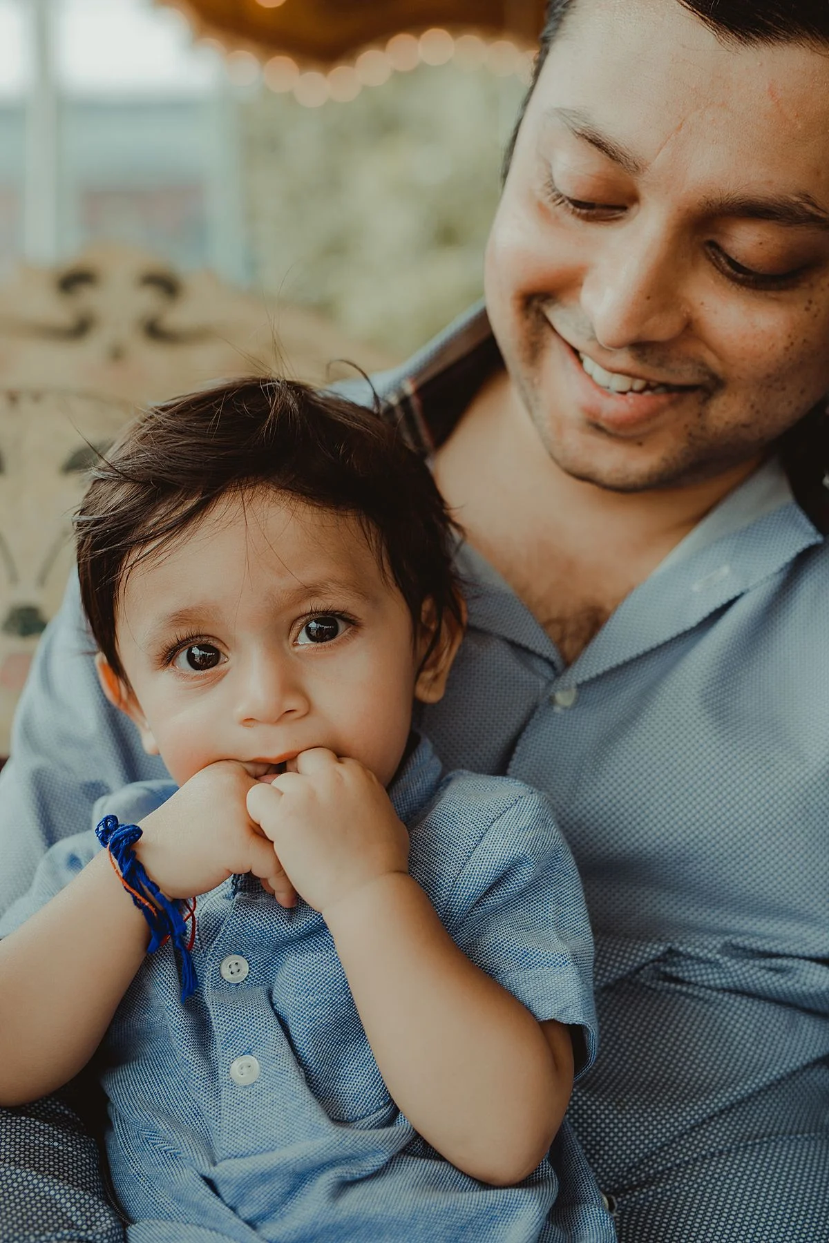 close up of dad and son at jane's corousel brooklyn. image by krystil mcdowall