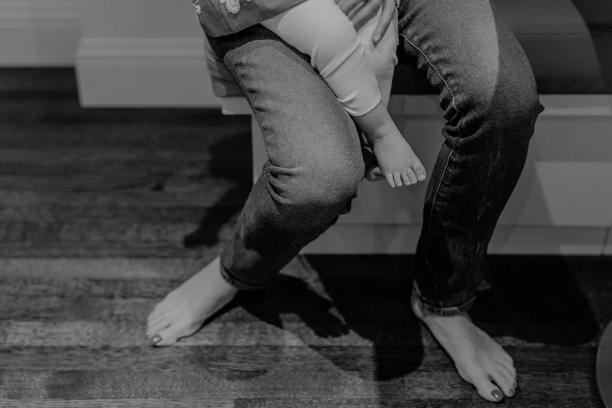 details shot of mom and daughters feet while they're sitting on the kitchen bench. photo by Krystil McDowall photography