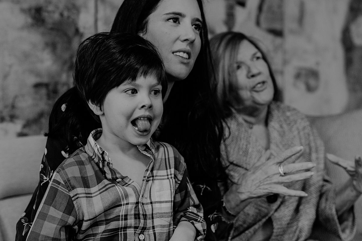 candid portrait of son, mother and grandmother chatting. photo by nyc family and newborn photographer Krystil McDowall