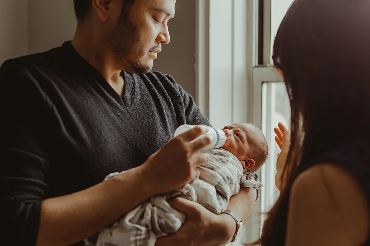Candid image taken during one of my in home lifestyle newborn photo sessions