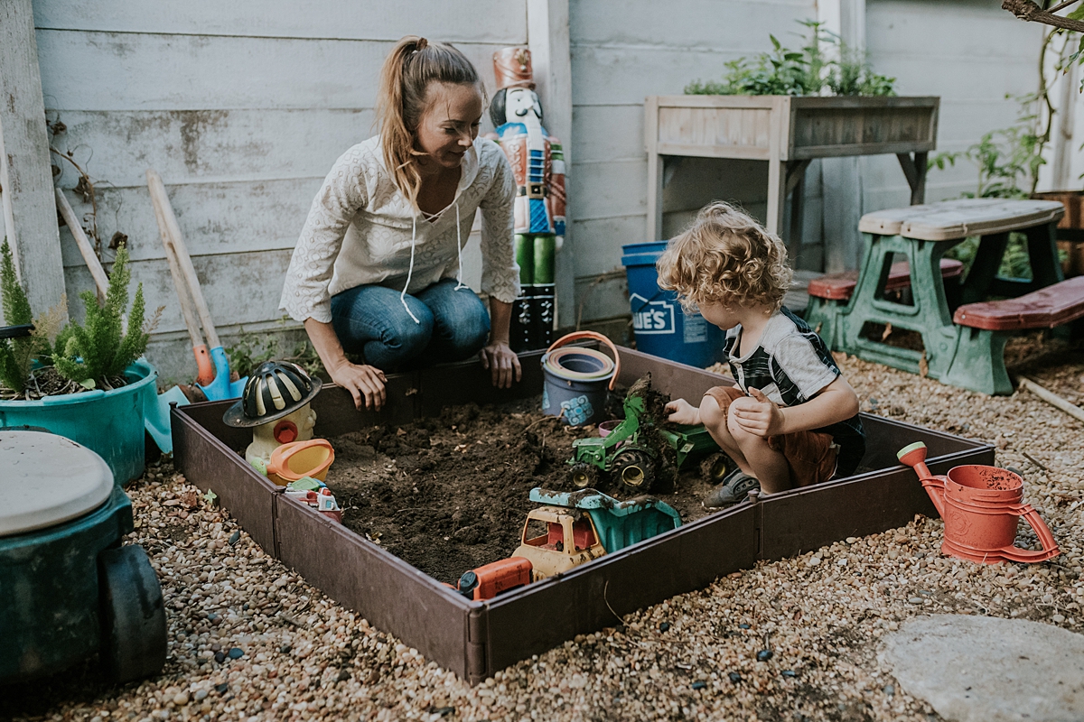 Orange County family photographer. Photo of mother and son gardening in their front yard during documentary photo session with Krystil McDowall Photography