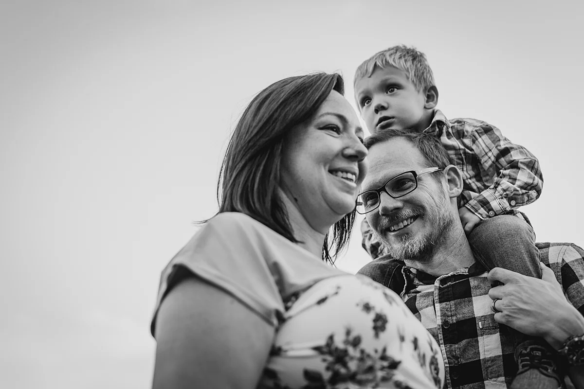 Orange County family photographer. Black and white photo of family of three taken during outdoor maternity photo session at Irvine Regional Park