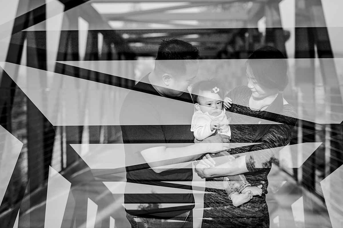 Orange County family photographer. Double exposure photo of mom, dad and sweet one year old daughter standing on bridge during outdoor family photo session at Jeffrey Open Space Trail in Irvine