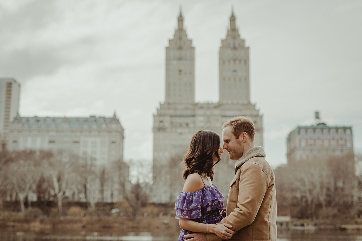 Orange County family photographer. Photo of pregnant couple with heads together during outdoor maternity photo session with Krystil McDowall Photography