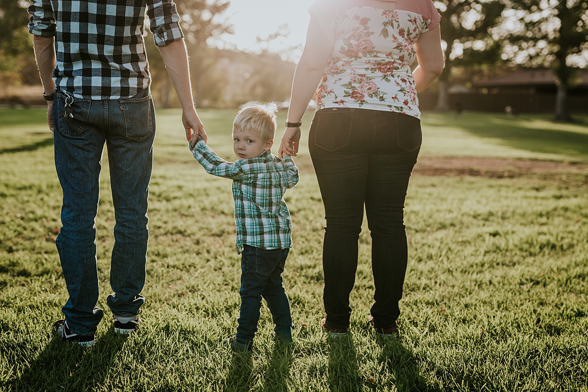 Orange County family photographer. Photo of family of three taken during outdoor maternity photo session at Irvine Regional Park