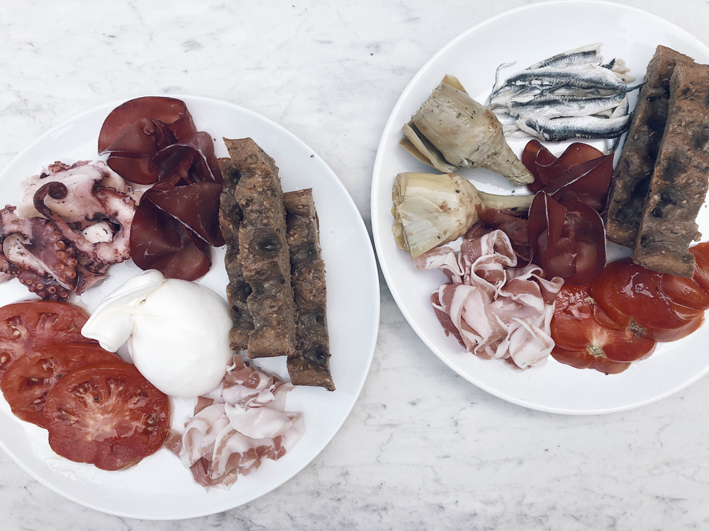Our daily Italian picnic with fresh produce from Alimentari Franca and bread from the bakery underneath our Airbnb.