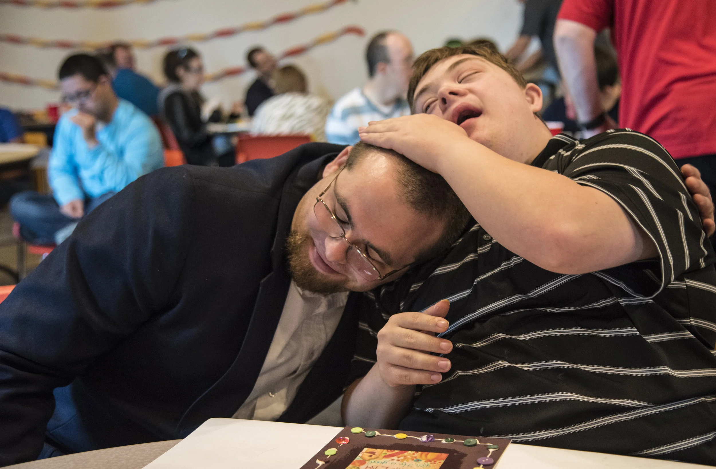  Kyle Seaworth, left, 27, of Loves Park, hugs Evan Groves, 24, of Freeport on Sunday, Sept. 25, 2016, at Rockford First Church. The two have been members of the Illuminators Sunday school class for about three years.&nbsp; 