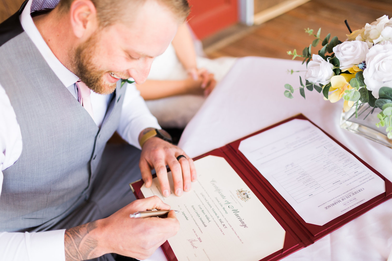 Signing+the+certificate+-+Gold+Creek+Station+Wedding.jpeg
