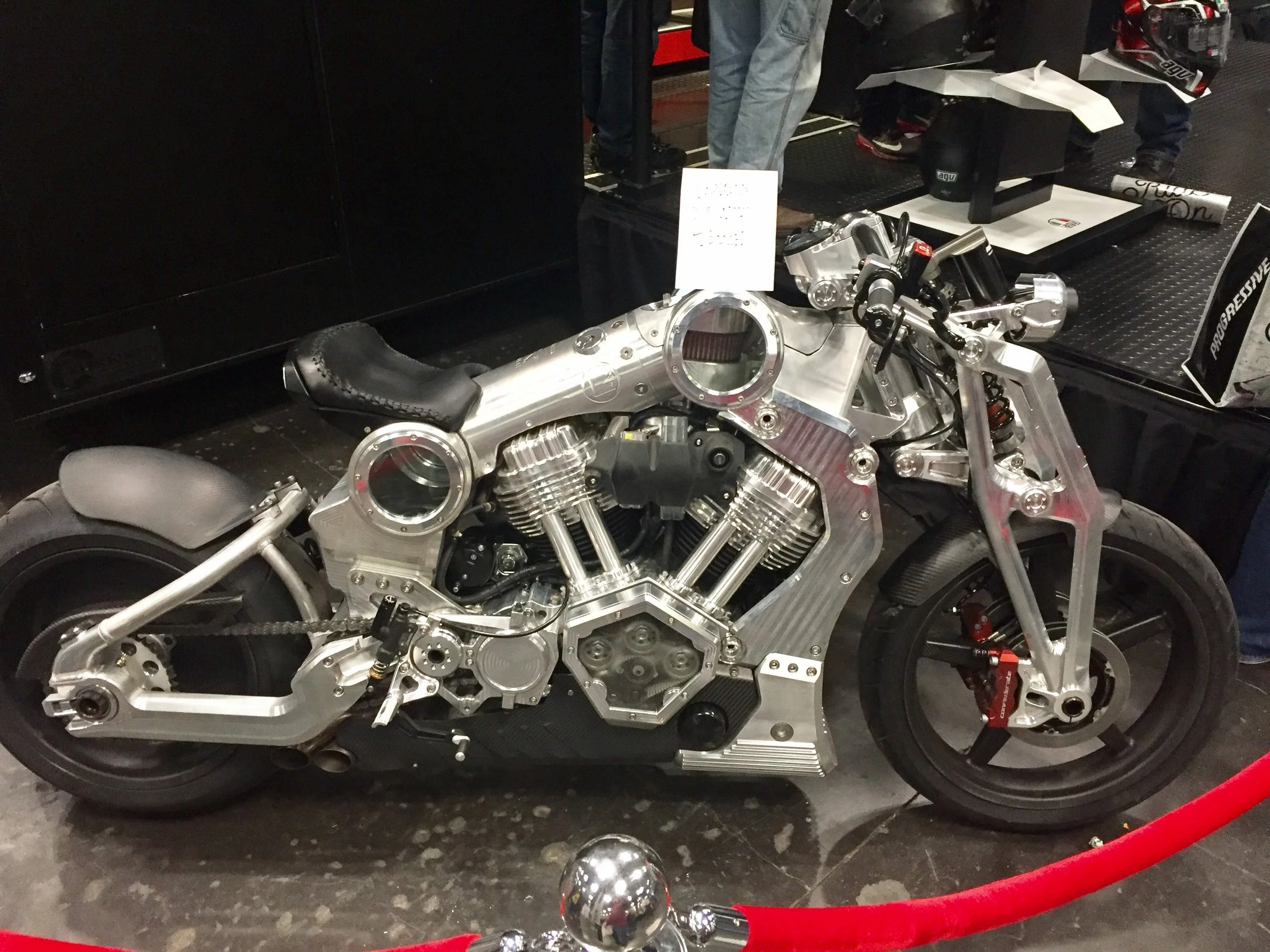 With its two see-through windows, this custom machine hangs out by a vendor booth.