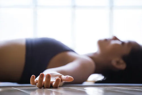 Shavasana or "corpse pose" in yoga is a lying meditation most yoga classes use to integrate the session at the end while cultivating healing & recovery.