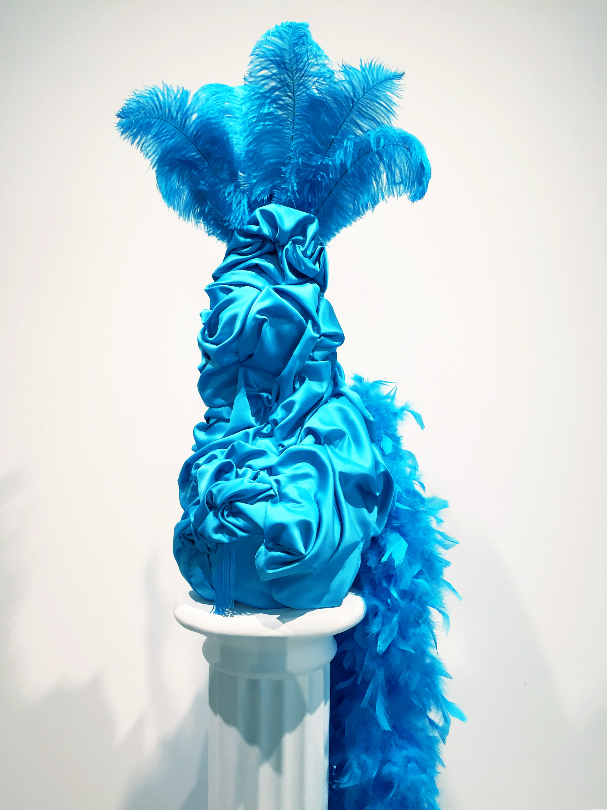 Esma , 2019 Polystyrene foam, fabrics, feathers, glass beads, sequins and dressmaker pins 31 x 8 x 8 inches