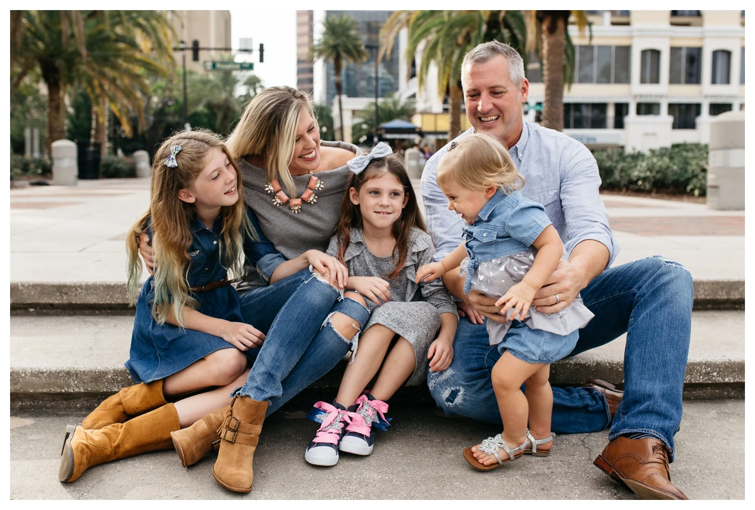 Family Sitting on Steps in Downtown Orlando During Family Photo Session.jpg