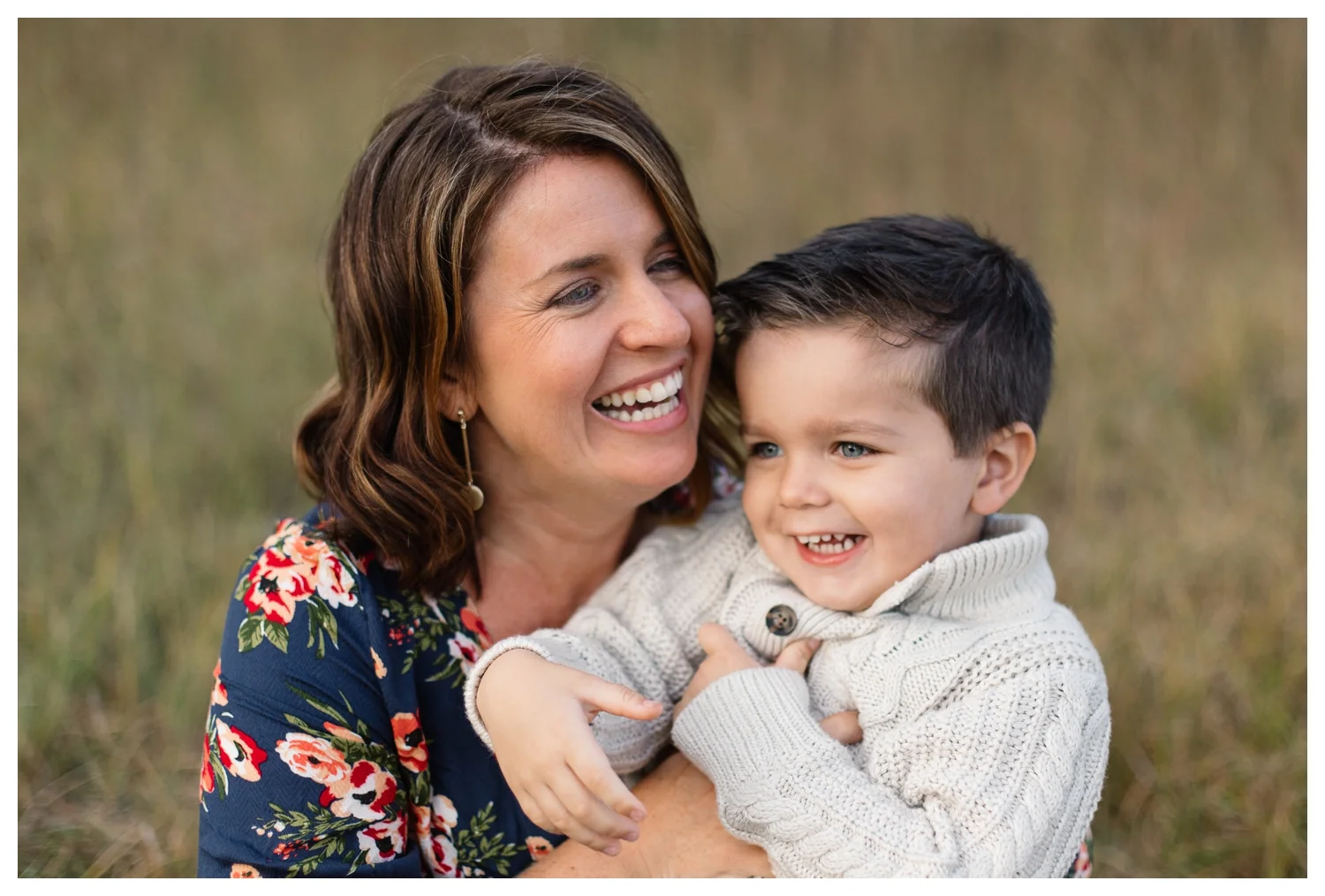 Mother and Toddler Boy in Field Laughing During Family Session Orlando Photographer.jpg