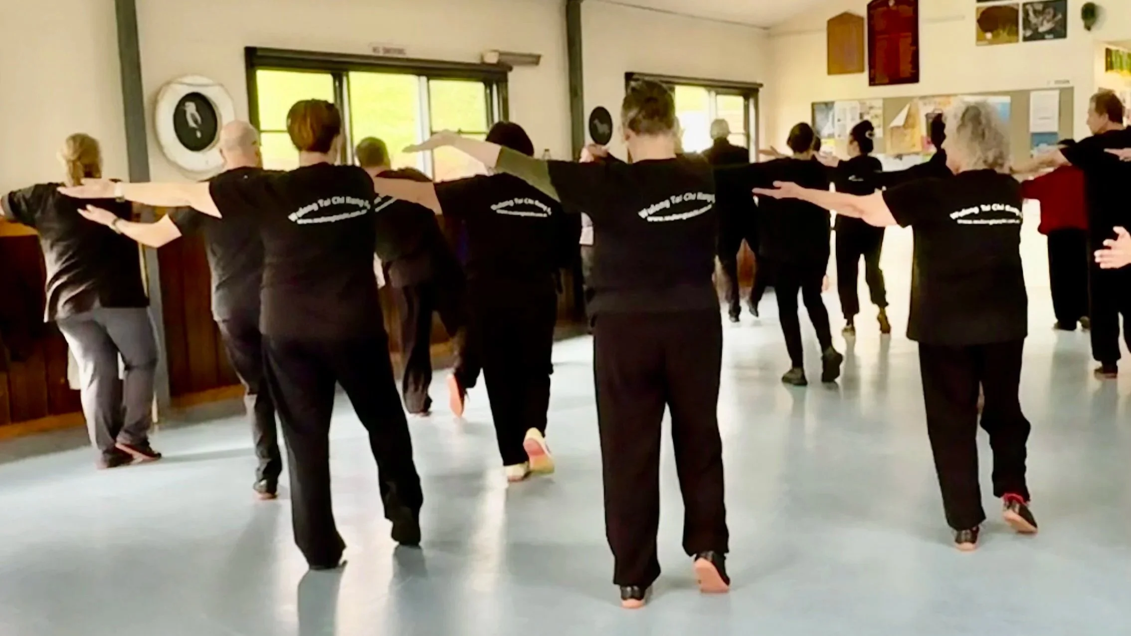 Wulong Tai Chi Kung Fu students practice tai chi walking